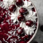chocolate cherry smoothie bowl with coconut whipped cream