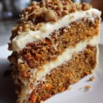 gluten-free carrot cake with cream cheese frosting and walnut topping