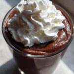 vegan chocolate avocado mousse dessert with coconut whipped cream