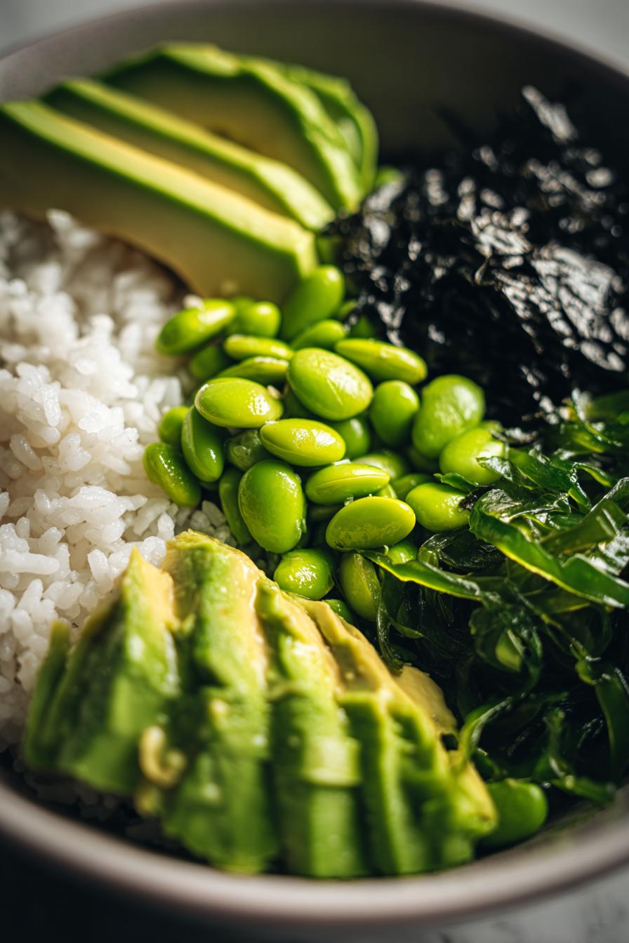 vegan sushi bowl with edamame, seaweed, avocado